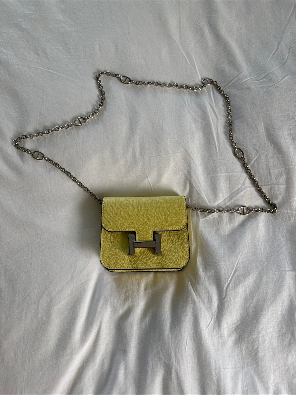 Mini Constance Crossbody wallet on a chain in Canary